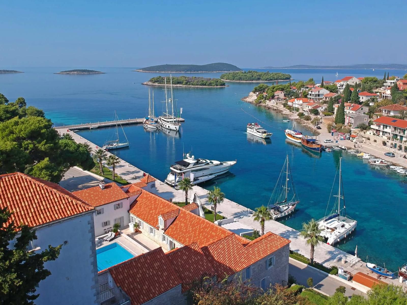 The harbour of Maslinica on the western coast of Šolta, with stone buildings around a small bay